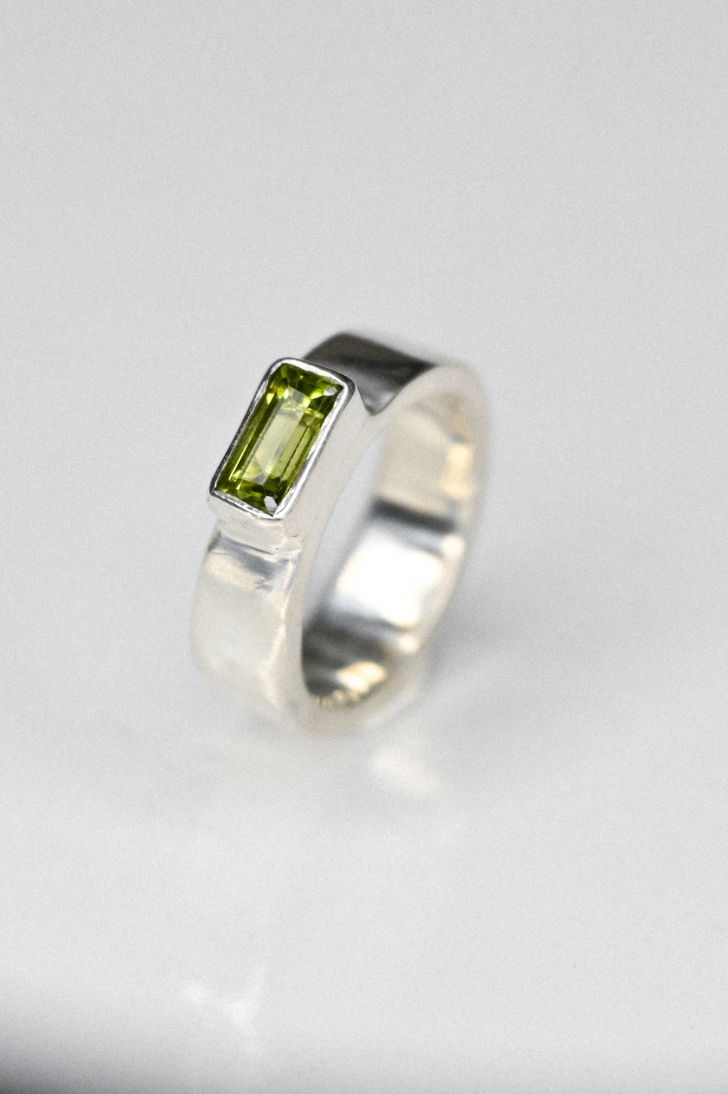 the one with a green peridot