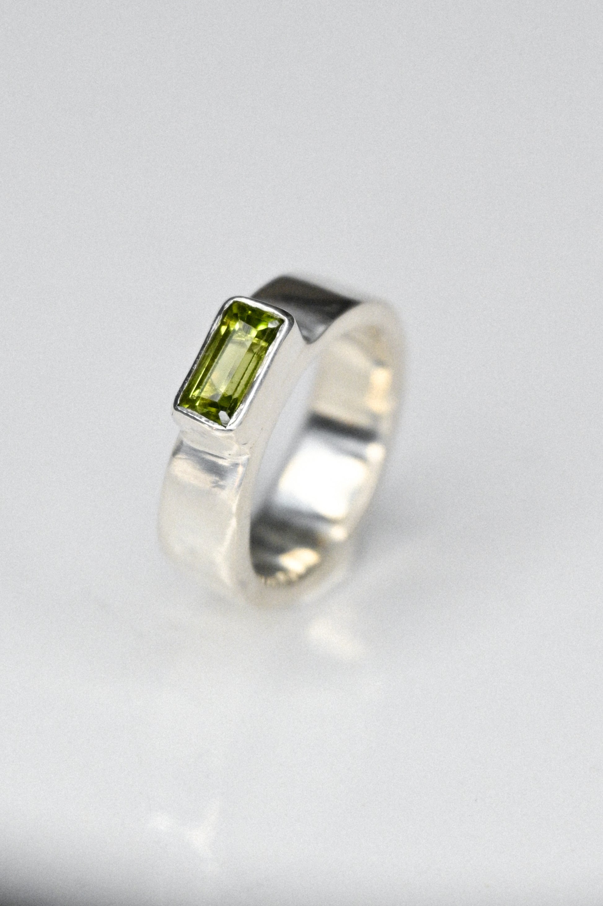 the one with a green peridot